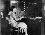 Picture relating to Emerald - titled 'Marjorie Elms at the Emerald telephone switch, 1928-1929'