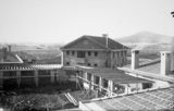 Picture relating to Ainslie - titled 'Hotel Canberra under construction, looking towards Mt Ainslie.'