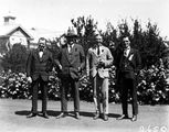 Picture relating to Canberra - titled 'Group of four people including Mr H J H Honeyset, Canberra Community News.'