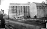 Picture relating to Kingaroy - titled 'Silos of the Queenslander Peanut Growers Co-op Pty. Ltd., Kingaroy, Queensland'