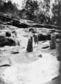 Picture relating to Stanthorpe - titled 'Elegantly dressed ladies and small child watching Winstead Falls flowing through granite rocks north of Stanthorpe, 1909'