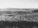 Picture relating to Ainslie - titled 'Reid, Braddon and Civic Centre from Mt Ainslie. Ainslie Hotel in the centre.'