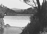 Picture relating to Cotter Dam - titled 'Cotter Dam wall spillway and stilling pond'