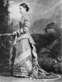 Picture relating to Queensland - titled 'Studio portrait of a woman in an elaborate, ruffled dress, 1870-1880'