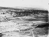 Picture relating to City Hill - titled 'Aerial view of Civic Centre looking up Northbourne Avenue, from over City Hill.'