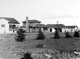 Picture relating to Braddon - titled 'Commercial buildings in Mort St, Braddon including garage and Canberra Times office.'