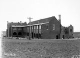 Picture relating to Red Hill - titled 'Church of England Boys Grammar School with Headmaster's residence ( Canon Edwards) on the right, under construction. Flinders Way, Red Hill.'
