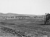 Picture relating to Ainslie - titled 'Duntroon Road now Fairbairn Avenue, Campbell under construction - Ainslie Hotel on the right.'